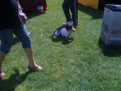Child on Grass During Earth Day Celebration at Wilshire Center